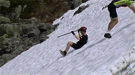 Olly gets sliding with the aid of his trusty stick at Halvfjerdingsvatnet